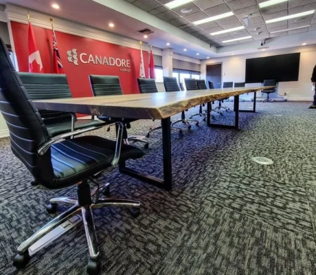 U-shaped steel leg base on maple boardroom table