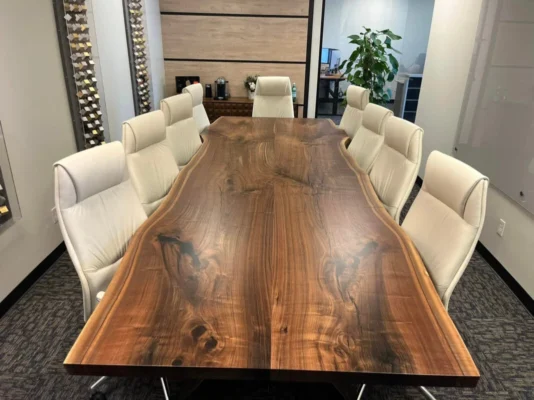 Large custom conference room table made from solid black walnut slabs